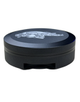 A round black metal container with a textured grip and a silver logo on top, shown against a plain white background.