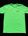 Green t-shirt with a small logo on a black background