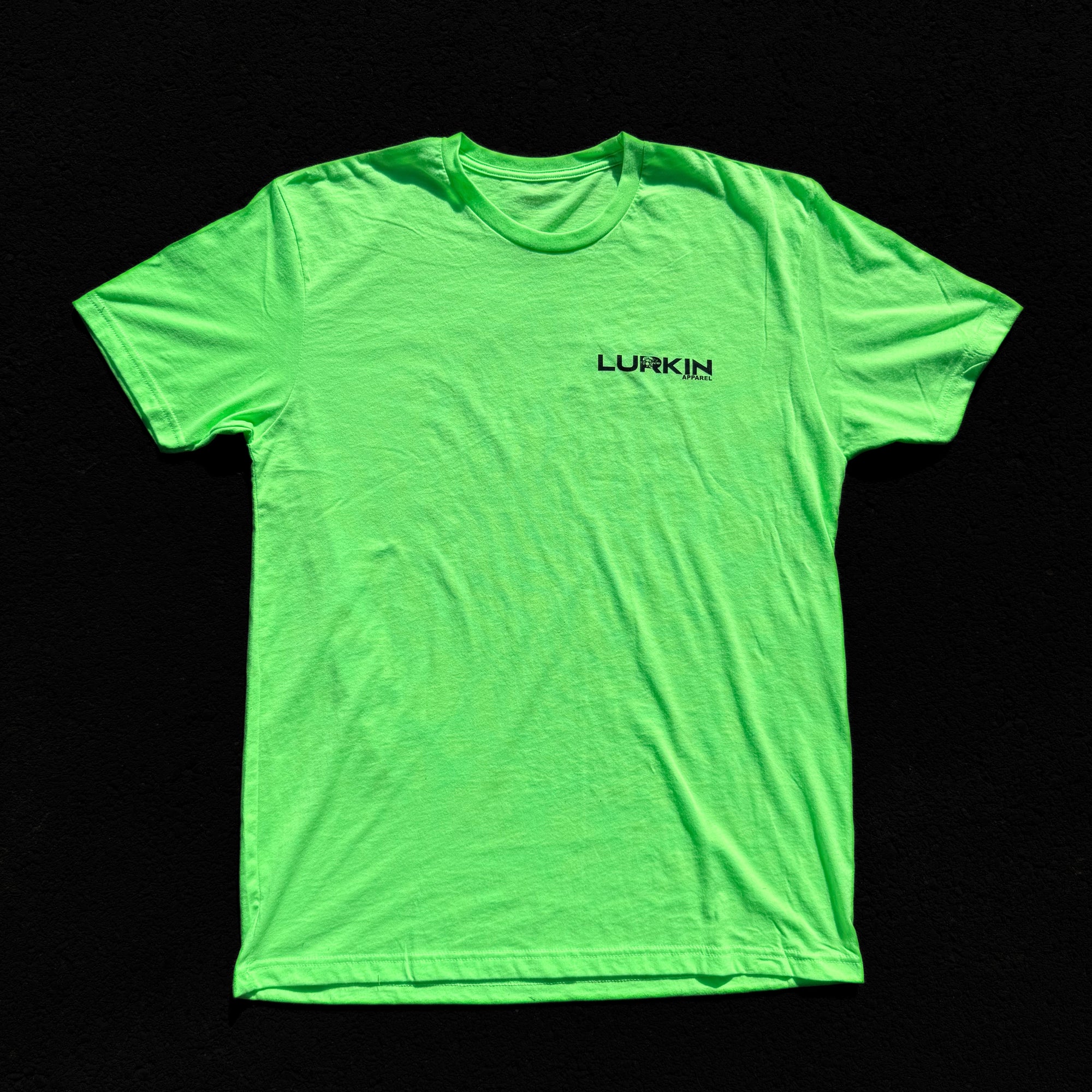 Neon green t-shirt with 'Lurkin' logo on a black background