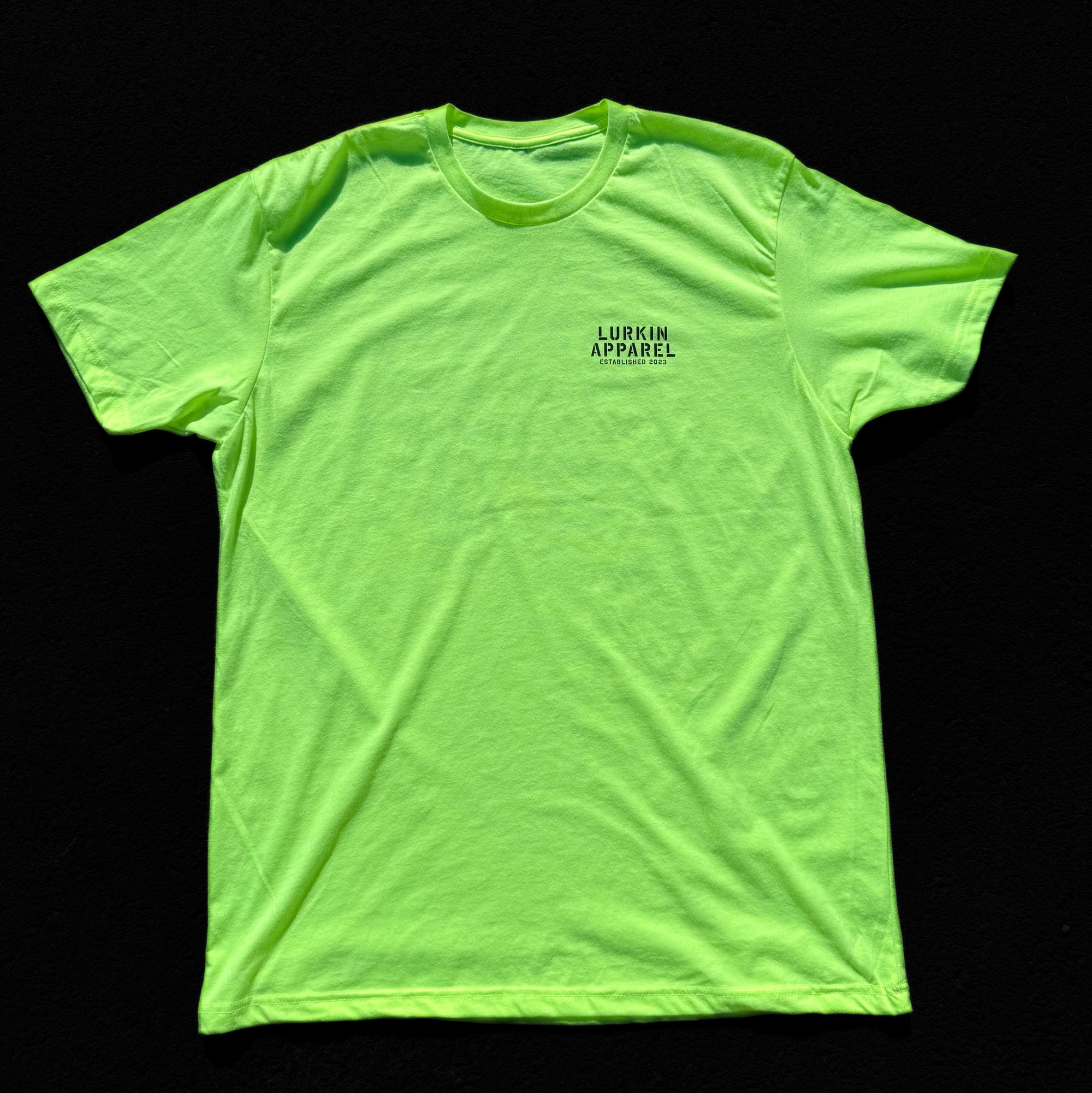 Neon yellow t-shirt with a brand logo on a black background