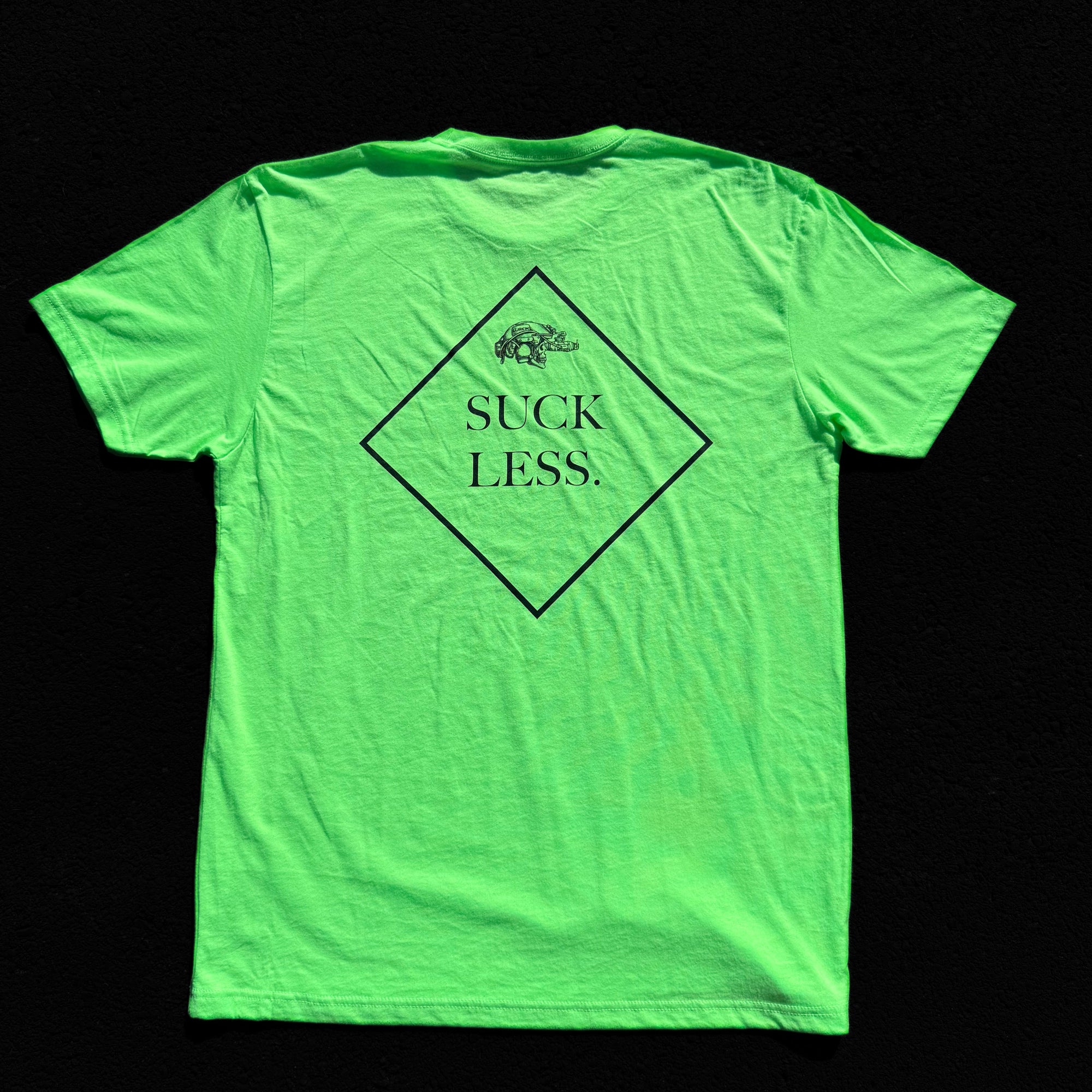 Neon green t-shirt with 'Suck Less' text on a black background